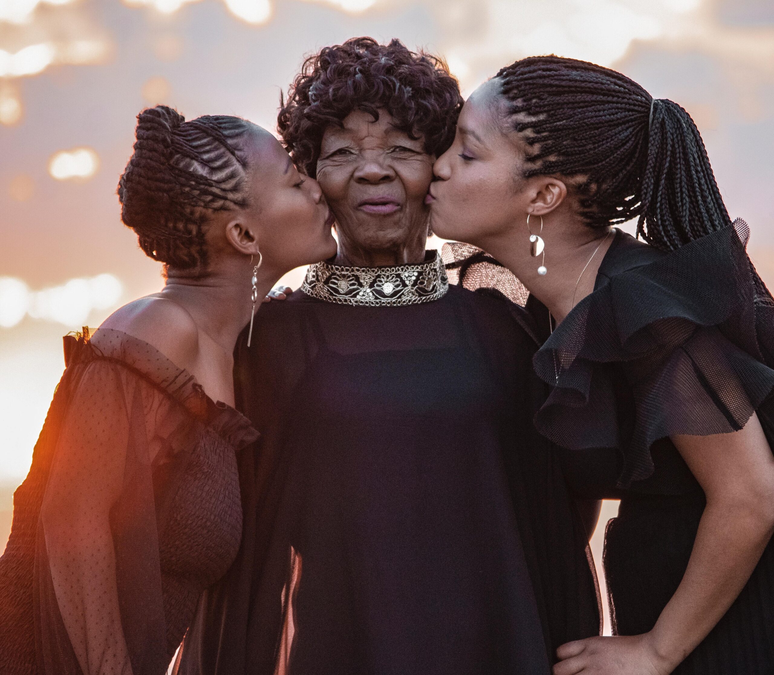 2 Daughters Kissing Grandma Cropped